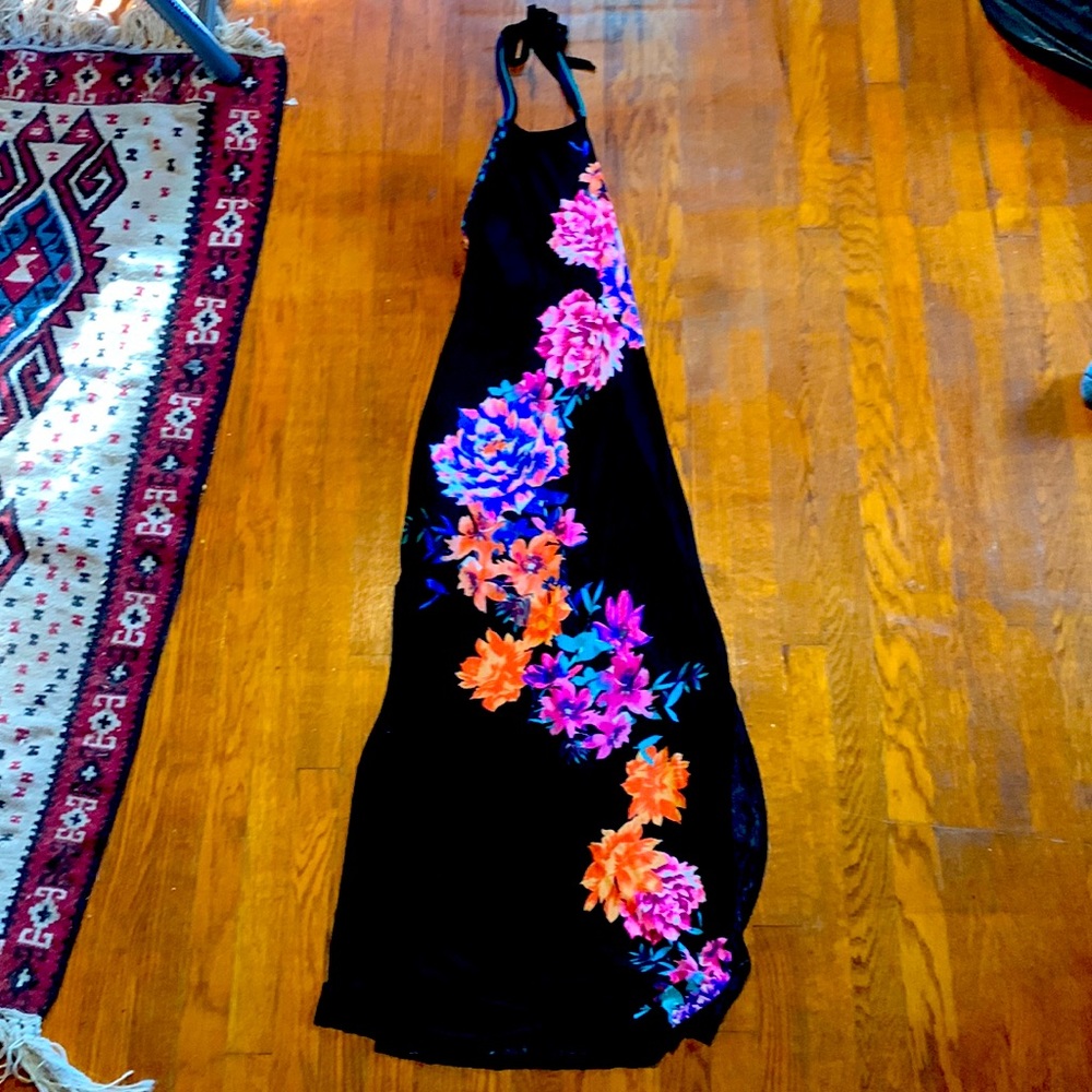 Backless maxi dress in black with floral print.